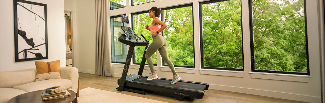 Woman running on a BowFlex treadmill