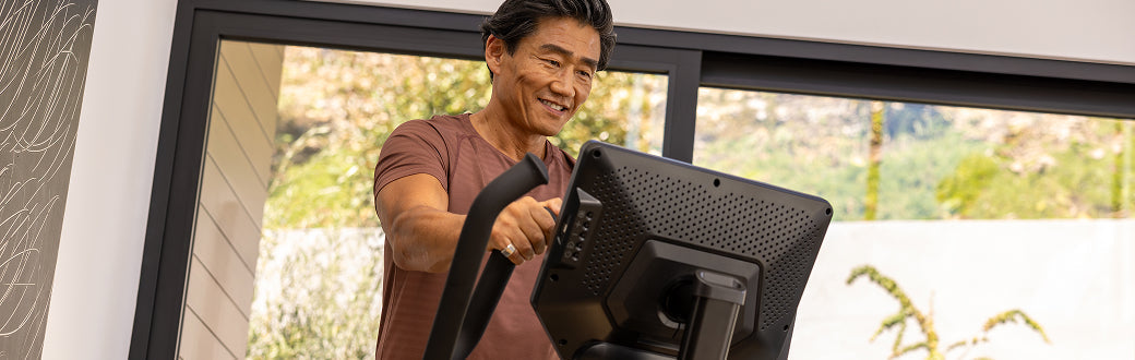 man using a bowflex maxtrainer
