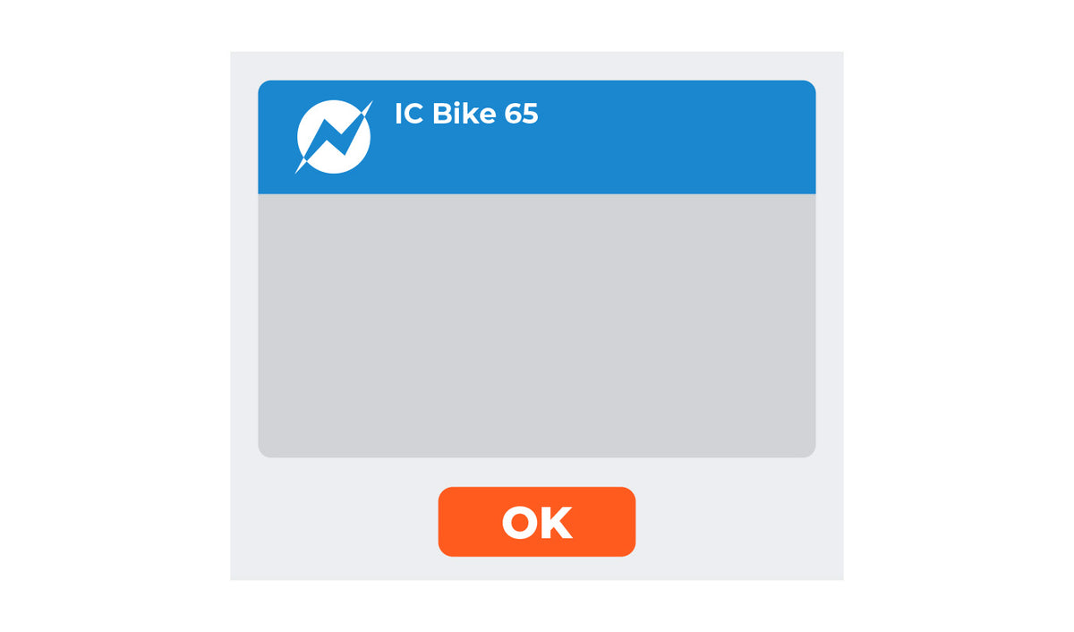Zwift app screen showing a blue header with the white IC Bike 65 logo and name and an orange OK button below.