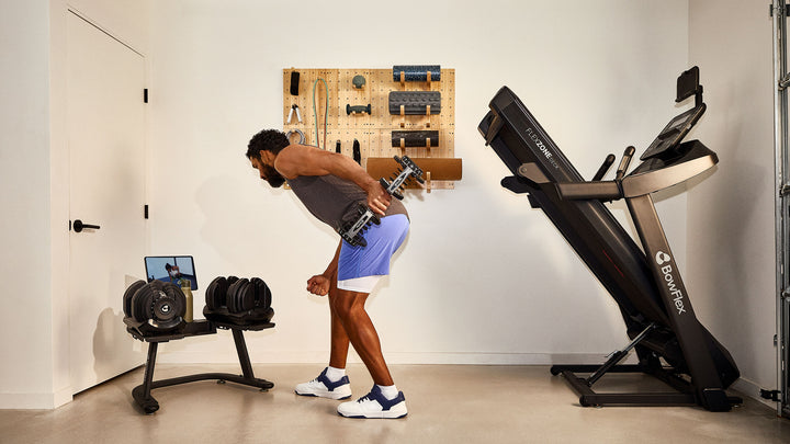 Man exercising with a single Results Series 1090 dumbbell