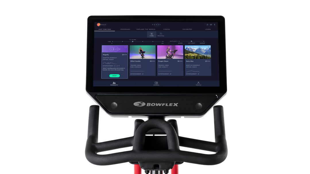 Bowflex exercise bike console with screen displaying workout options on a white background