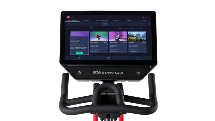 Bowflex exercise bike console with screen displaying workout options on a white background