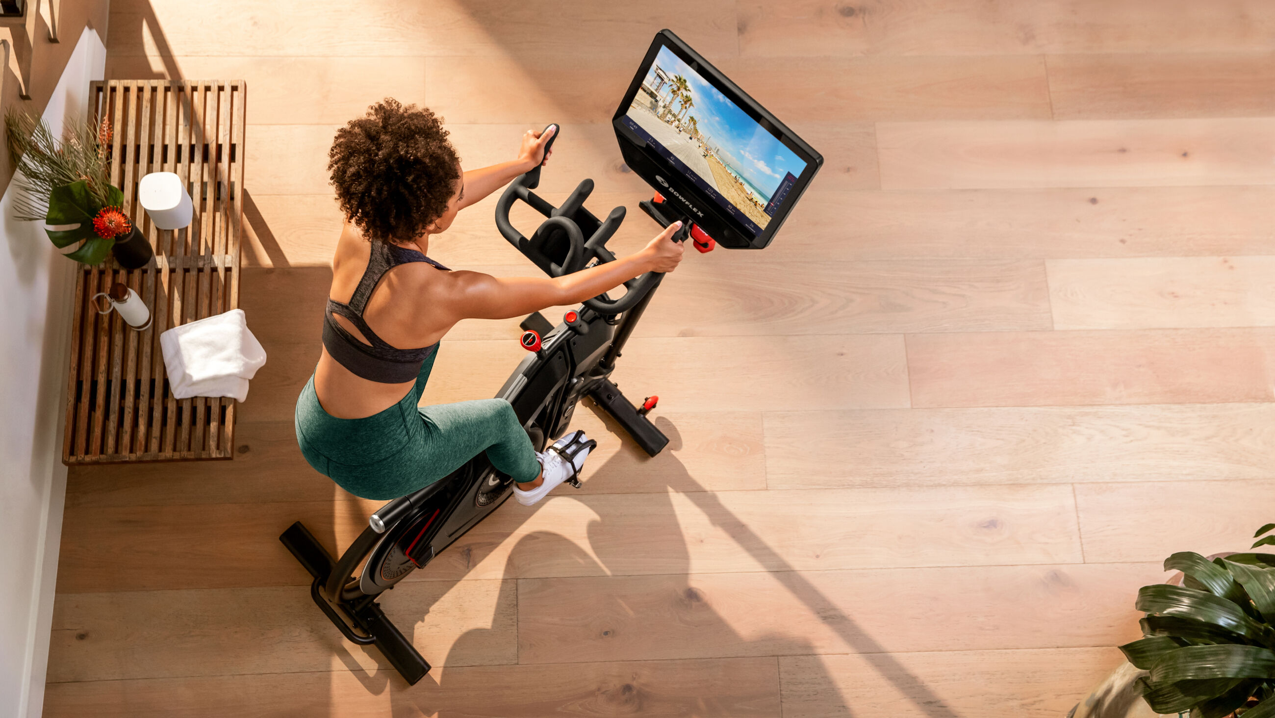 View from above of a woman riding BowFlex VeloCore Bike - default view