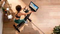 View from above of a woman riding BowFlex VeloCore Bike - thumbnail