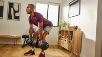 Man exercising with a pair of Results Series 552 dumbbell--thumbnail