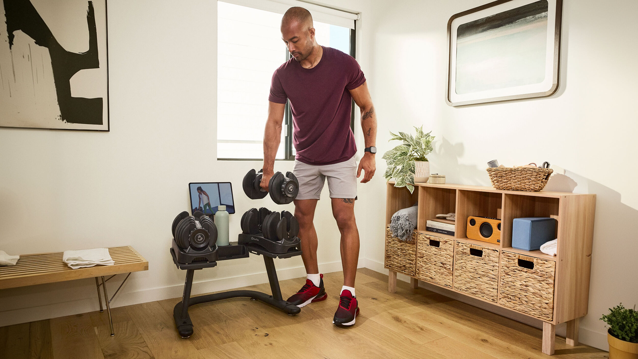 BowFlex SelectTech Adjustable Dumbbell Stand - Man Using Stand - default view