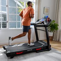 Woman jogging on a Bowflex BXT8J Treadmill--thumbnail