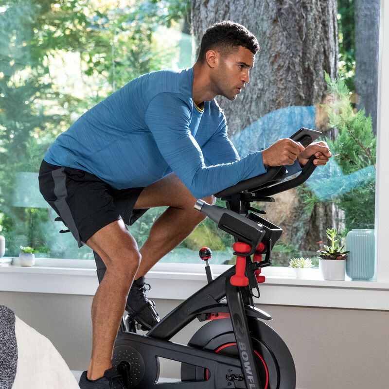 Man riding a stationary Bowflex C6 exercise bike - mobile expanded view